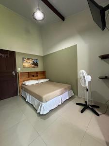 Postel nebo postele na pokoji v ubytování Recanto Guarassol Apartamentos