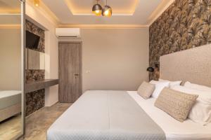 Postel nebo postele na pokoji v ubytování Lazai Villa