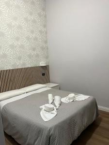 A bed or beds in a room at Les Artes