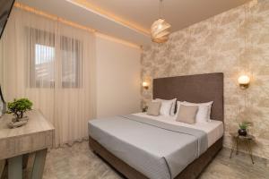 Postel nebo postele na pokoji v ubytování Lazai Villa
