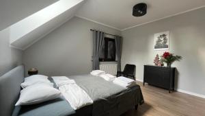 Posteľ alebo postele v izbe v ubytovaní Apartamenty Czarna Perła