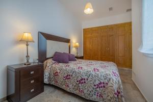 Postel nebo postele na pokoji v ubytování Kurtuba Suites