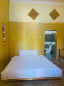 A bed or beds in a room at Green homestay Mai chau