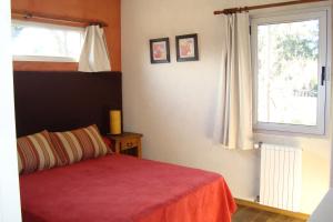 מיטה או מיטות בחדר ב-Cabañas del Espera N 65