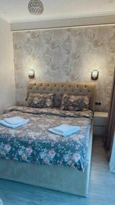 Postel nebo postele na pokoji v ubytování Vitali Apartment