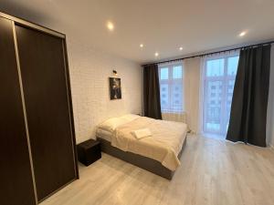 Krevet ili kreveti u jedinici u objektu Apartamenty KTW CENTRAL STATION