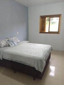 En eller flere senge i et værelse på aluga-se casa Itapeva torres + 28 billeder