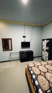 Televisi dan/atau pusat hiburan di Setiya Homestay