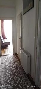 Łóżko lub łóżka w pokoju w obiekcie Karancs Apartman Salgótarján