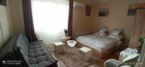 Łóżko lub łóżka w pokoju w obiekcie Karancs Apartman Salgótarján