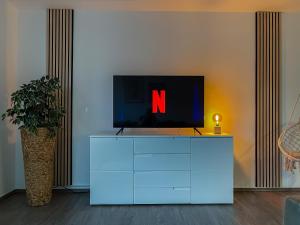 TV tai viihdekeskus majoituspaikassa Paderborn City - Parkplatz - Netflix