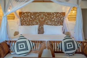 Postel nebo postele na pokoji v ubytování Alma Boutique Hotel
