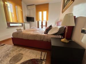 Posteľ alebo postele v izbe v ubytovaní Castelvecchio Apartment
