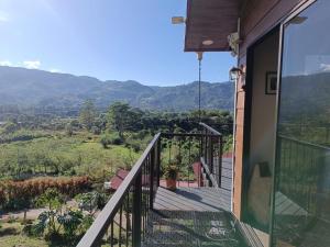 a balcony of a house with a view of the mountains at Apartment Ujarraz Irola's in Cartago