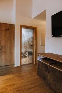 Televízia a/alebo spoločenská miestnosť v ubytovaní Apartments Haufhof , Haus im Ennstal bei Schladming