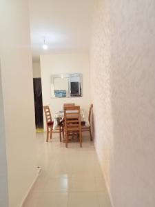 a dining room with a table and chairs at ifrane house in Ifrane