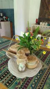a plate with a plant in a bowl on a table at Chalet para 7 en Mar del Plata con parque y parrilla in Mar del Plata +14 photos