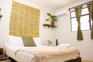 Ένα ή περισσότερα κρεβάτια σε δωμάτιο στο Casa Niita