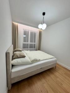 Кровать или кровати в номере Forest Apart IV