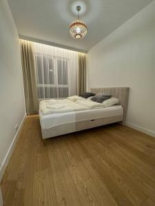 Giường trong phòng chung tại Forest Apart IV