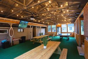 a large room with a ping pong table and a ping pong table at Spacious Pickleball Pines in South Haven