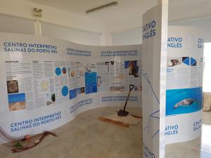 a exhibit in a room with posters on the wall at Torre Sabina in Vila do Porto +35 photos