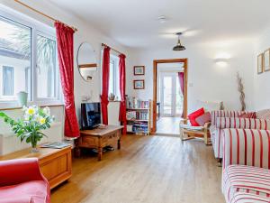 a living room with a couch and a table at 3 Bed in Welsh Newton Common 52149 in Welsh Newton Common