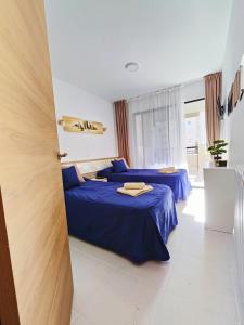 Łóżko lub łóżka w pokoju w obiekcie Playa Levante Lux Mar
