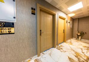 a corridor with a damaged room with a door at The Business Class Hotel in Istanbul