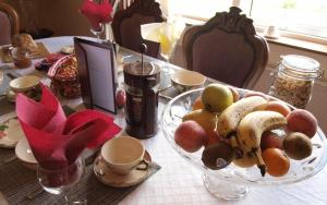 a table with a bowl of fruit on a table at Glencove in Ennis