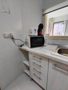 Telewizja i/lub zestaw kina domowego w obiekcie Playa Levante Lux Mar