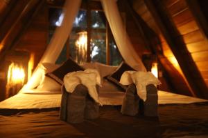 Gulta vai gultas numurā naktsmītnē Cinnamon Paradise Nature Room