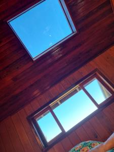 an overhead view of two windows in a wooden ceiling at Pousada nevadas da Serra in Urupema