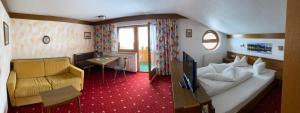Posteľ alebo postele v izbe v ubytovaní Landhaus Engadin