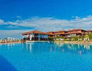 a resort with a large pool of blue water at Созопол Sozopol- SOZOPOLIS - MORE SUN 2В in Sozopol