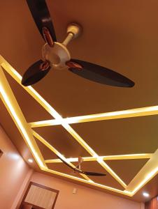 a ceiling fan with lights on a ceiling at Hotel Ashok Vihar in Bhabua