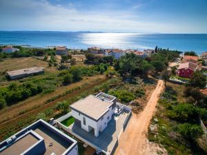 an aerial view of a house and the ocean at Villa Linda in Zaton +42 photos