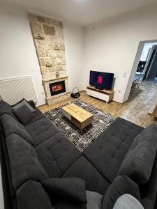 Posezení v ubytování AG.Stone.Home