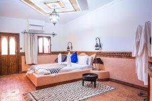 a bedroom with a large bed in a room at Riad Rihana Dades in Boumalne