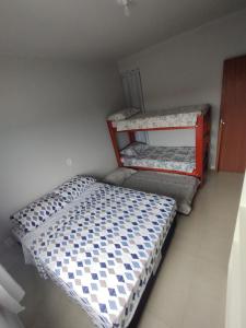 Ein Bett oder Betten in einem Zimmer der Unterkunft Selva Park - Apartamentos completos - próximo ao Beto Carrero e praias