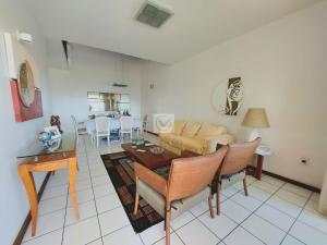a living room with a couch and a table at Casa vista mar in Aracaju