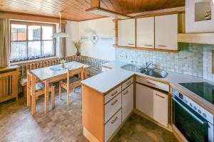 a kitchen with a sink and a table in it at Private Farmhouse Escape - Ideal for up to 8 Guests in Seeham