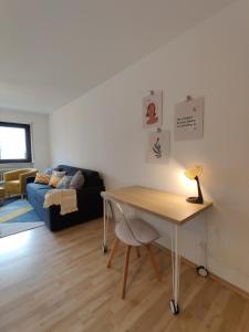 a living room with a table and a couch at 81qm, 3 bedroom, King-Bed, parking, fast Wifi, Netflix in Waiblingen