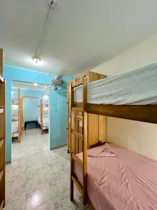 a bedroom with two bunk beds in a room at Hostel Samara in Sámara