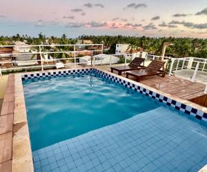a large swimming pool on top of a building at Top-Flat @ Bella Maré in Maragogi