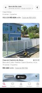 a screenshot of a page of a house with a fence at Casa em Barra de São João in Barra de São João