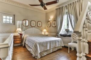 Giường trong phòng chung tại Villa Le Fontanelle