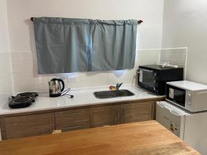 Η κουζίνα ή μικρή κουζίνα στο Panchito