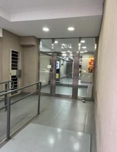 an entrance to a hotel lobby with a revolving door at Monoambiente con amenities Y MAS in Buenos Aires