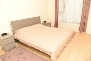 Postel nebo postele na pokoji v ubytování Apartman Julija